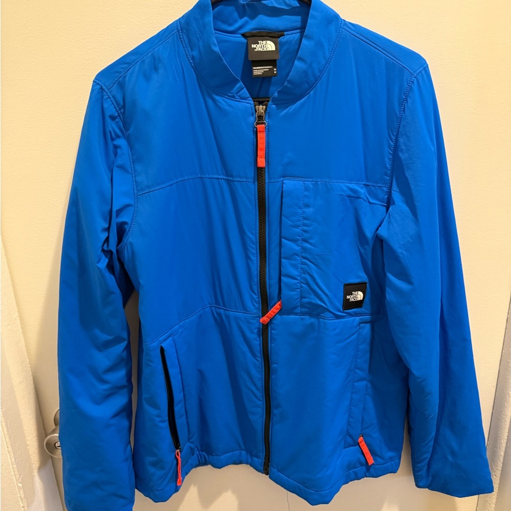 The North Face Bright Blue Jacket with Orange Zip Pull
